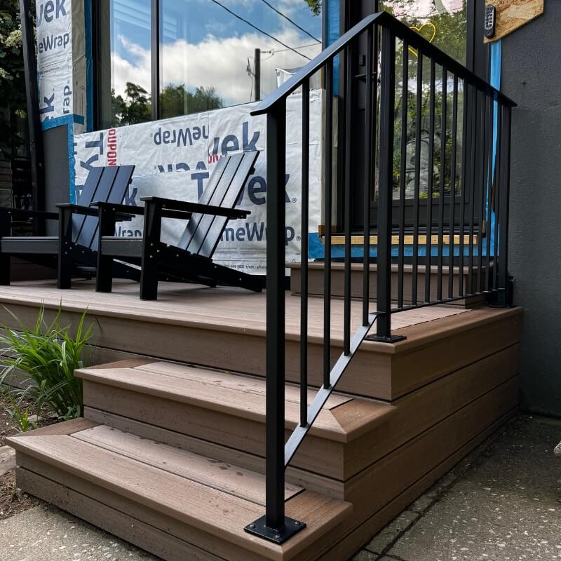 Custom exterior steel railings with flat bar top and bottom rail, square posts and pickets